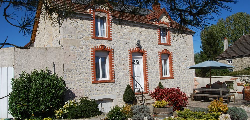 A Building with a clock on the right side of it in the Limousin Region.