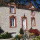 A Building with a clock on the right side of it in the Limousin Region.