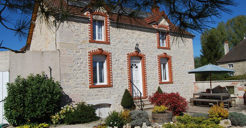 A Building with a clock on the right side of it in the Limousin Region.