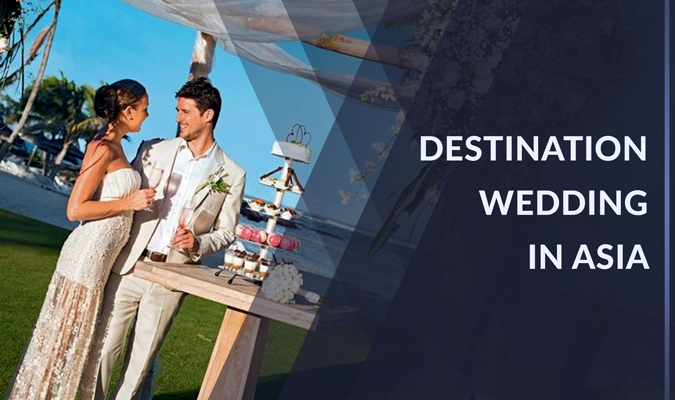 Couple Dressed In Wedding Costume Enjoying A Drink Together At Their Destination Wedding In India With Blue Sea In The Background 